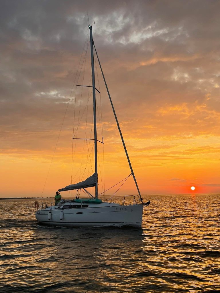 Sailing yacht Bella at sunset near Muhu